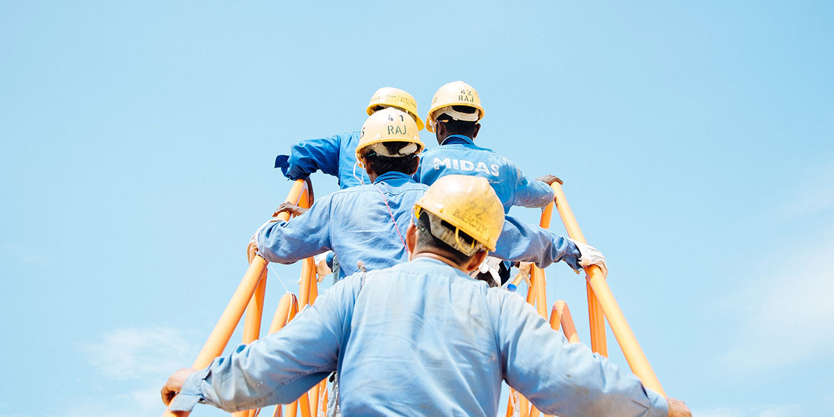 Contractors climbing steps