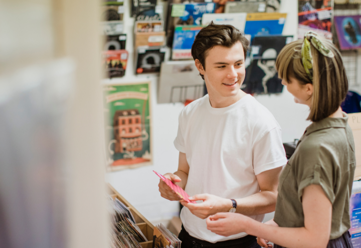 Two people working in retail and hospitality