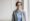 Woman in suit wearing glasses